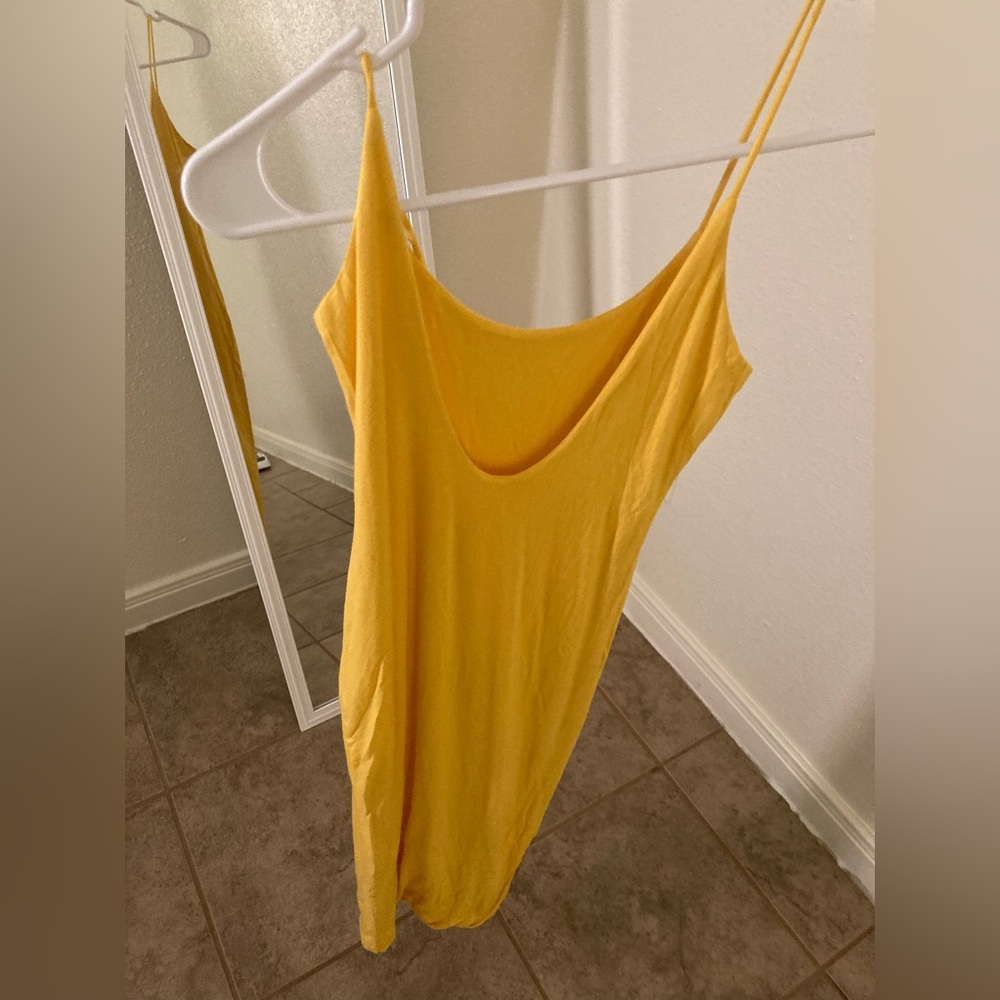 YELLOW DRESS THE STRAP IS RIPPED SO ITS TIED DUE TO TIME TO SOW IT!!